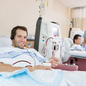 Portrait,Of,Young,Male,Dialysis,Patient,Holding,Glass,Of,Crushed