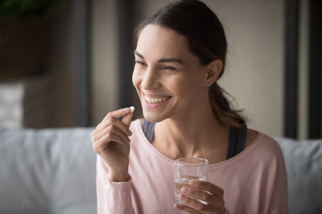 Woman taking birth control pill