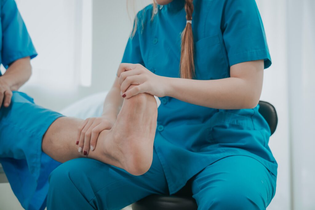 Achilles tendon pain treatment with a person applying ice to the back of the heel