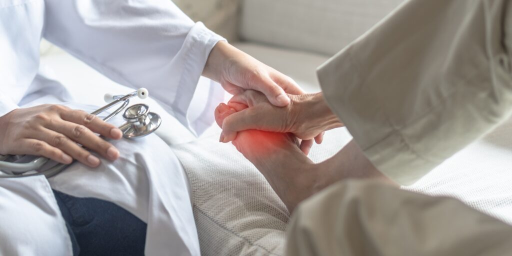 Person experiencing numbness and tingling in feet, illustrating causes such as diabetic neuropathy and nerve compression
