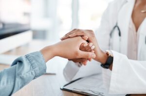 Couple discussing infertility concerns with doctor, representing myths and facts about infertility and reproductive health