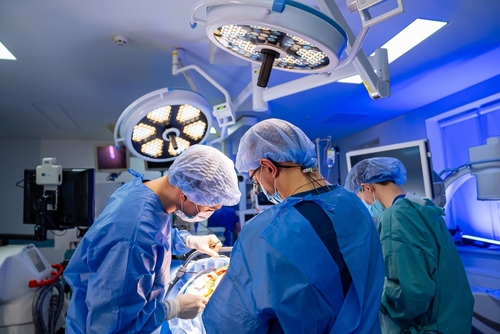 Robotic minimally invasive cardiac surgery with surgeon controlling robotic arms for precise heart procedure