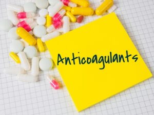Essential anticoagulation management service guidelines explained 1 Healthcare professional monitoring anticoagulation therapy and reviewing inr blood test results for patient safety