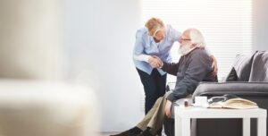 Elderly dementia patient looking confused while eating food, representing taste changes and altered eating behavior in dementia