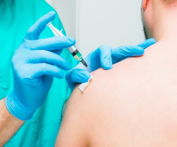 Close,Up,Neurologist,Doctor,Makes,An,Injection,Therapy,,Blockade,Into