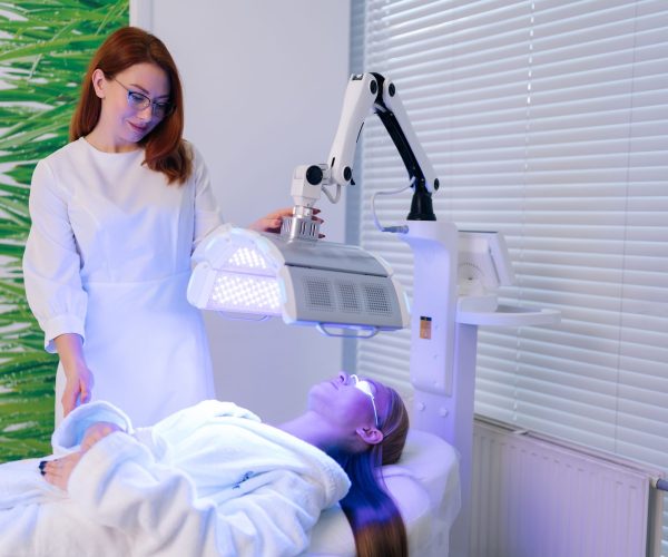 Portrait,Of,Pretty,Beautician,Specialist,Connecting,And,Adjusting,Innovation,Device