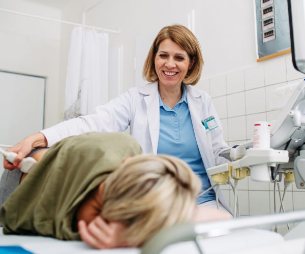 Medical,Examination,With,Ultrasound,Probe,On,Lower,Back